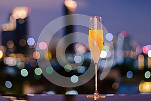 A glass with vapour of cold Champagne on table