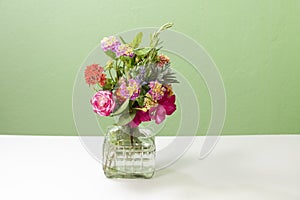 Glass vase with assorted flowers