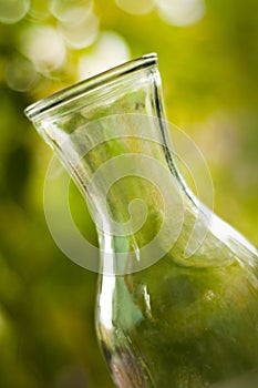 Glass vase on a green background. Shallow DOF.