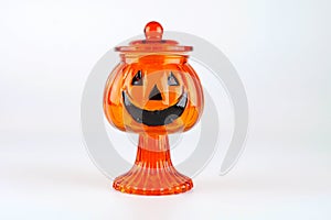 Glass vase pumpkin for halloween decoration isolated on white background