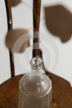 glass vase on a wooden background. Minimal photography studio