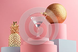 Glass of vermouth with vodka, golden pineappla and glitter ball