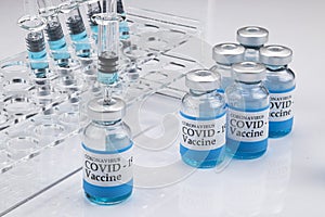 Glass vials labelled with COVID-19