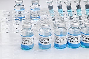 Glass vials labelled with COVID-19