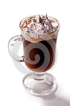 Glass of Viennese coffee topped with whipped cream isolated on white background