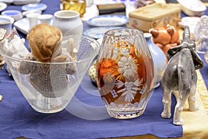 glass vintage vases and china elephant on sale at street market, Chiavari , Italy