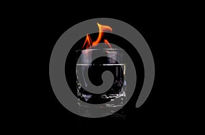 Glass with vodca and fire flame