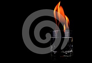 Glass with vodca and fire flame