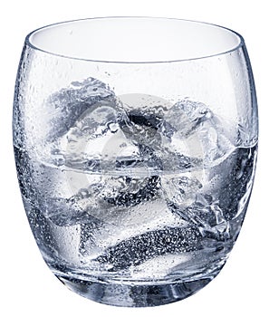Glass of vodka or gin, chilled alcohol drink, with ice cubes isolated on white background. Clipping path