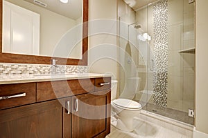 Glass walk-in shower in a bathroom of brand-new home