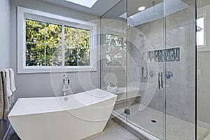 Glass walk-in shower in a bathroom of new luxury home