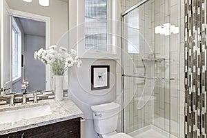 Glass walk-in shower in a bathroom of new luxury home