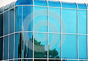 Glass wall of modern building with curved corners