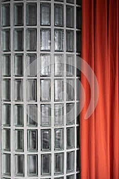 Glass wall with transparent blocks and curtain