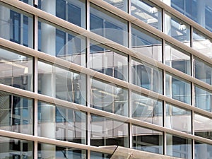 Glass wall with windows of office building in modern high-tech style design