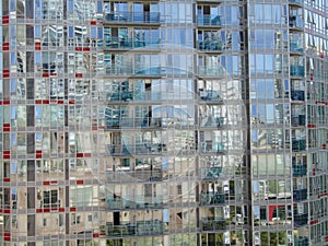 Glass walls of modern high-rise apartment building. Vancouver, BC, Canada.