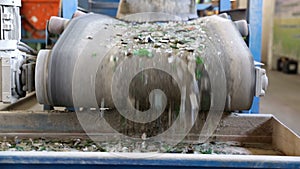 Glass waste in recycling facility. Glass particles