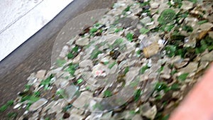 Glass waste in recycling facility. Glass particles in a machine