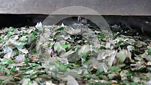 Glass waste in recycling facility. Glass particles in a machine