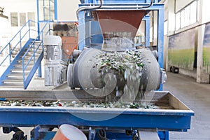 Glass waste in recycling facility. Glass particles