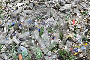 Glass waste in recycling facility. Pile of bottles.