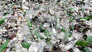 Glass waste in recycling facility. Pile of bottles. Pan