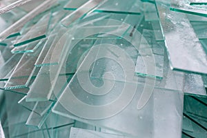 Glass waste sheets close up in containers , waiting the transport back to the factory