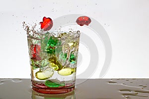 A glass of water with bubbles and splashes