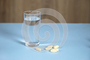 Glass of water with drugs
