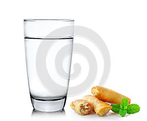 Glass of water and Fried Chinese Traditional Spring rolls food