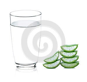 Glass of water and green aloe vera