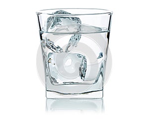 Glass of water with ice cubes. Cold water good for dehydration in the summer. Frozen water in shape of cube.