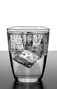 A glass of water with ice cubes