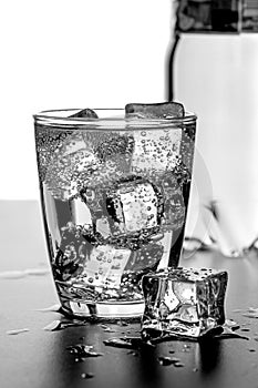 A glass of water with ice cubes