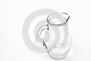 Glass water jug on white background