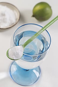 Glass of water, lemon, soda bicarbonate natureal solution