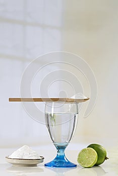 Glass of water, lemon, soda bicarbonate natureal solution