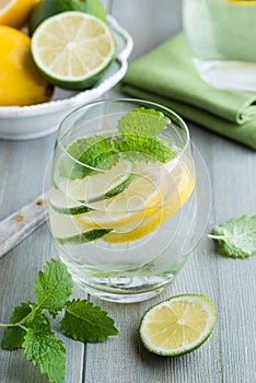 Glass of water with lime and lemon