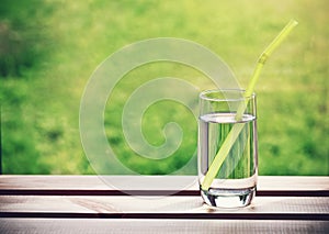 Glass of water with pipe