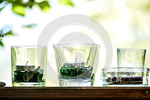 glass of water on table in garden photo