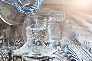 Glass of water on a wooden table