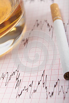 Glass Of Whiskey And Cigarette On ECG Printout