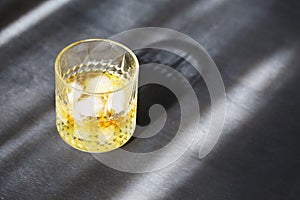 Glass of whiskey on dark background. Close up photo