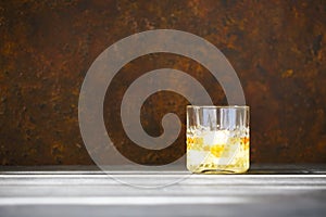 Glass of whiskey on dark background. Close up photo