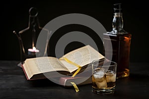 A glass of whiskey and a good book