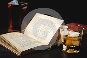 A glass of whiskey and a good book