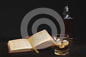 A glass of whiskey and a good book