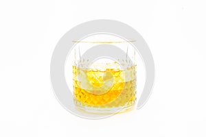 Glass of whiskey and ice isolated on white background