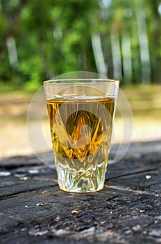 Glass of whiskey on a table