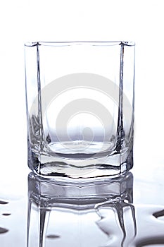 A glass of whiskey on a white background